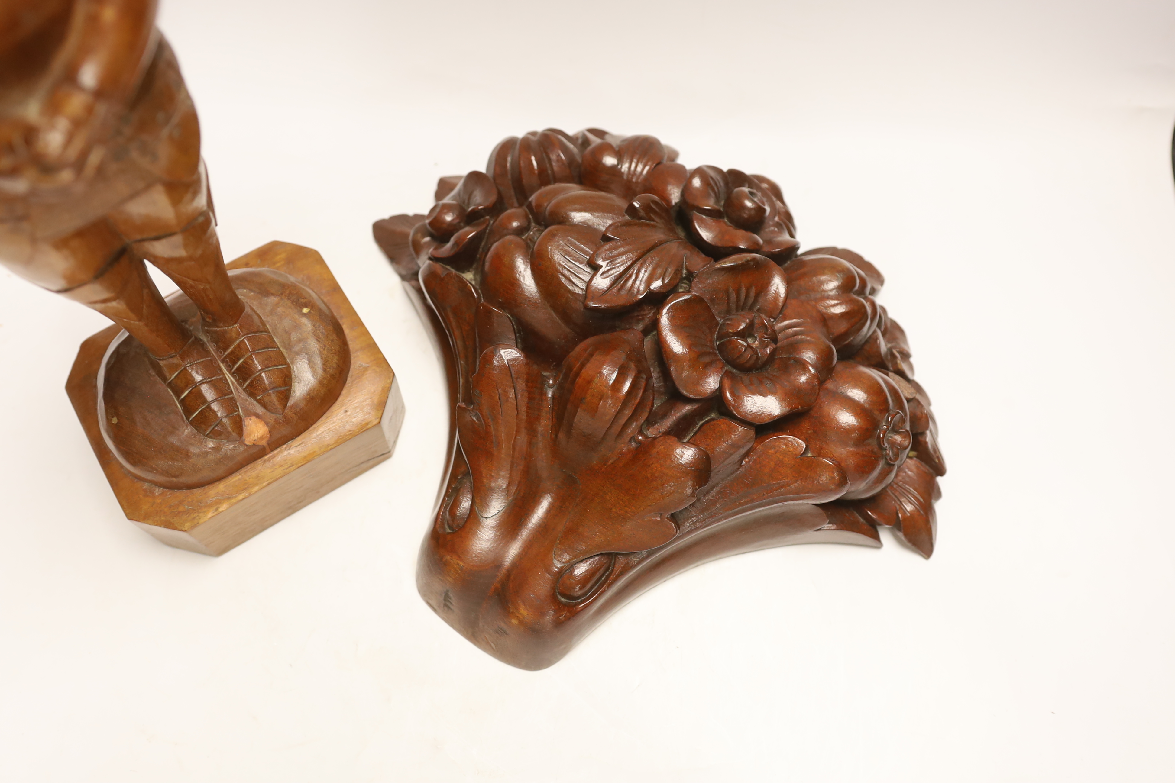 A carved model of Joan of Arc, stamped A.H. Healey, and an Ehrier? carving of fruit and flowers, tallest 41cm